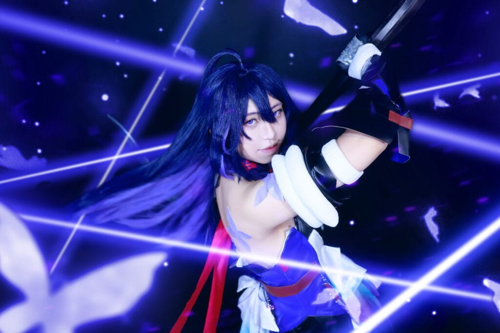 Purple sword cosplay action photo with dramatic lighting