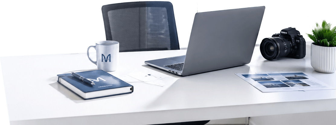 Contact Miura Visual Malaysia | Start Your Project 1 Minimalist Miura Visual studio workspace with a laptop, camera and light blue background